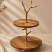 Wooden tiered stand with gold accents on a neutral background